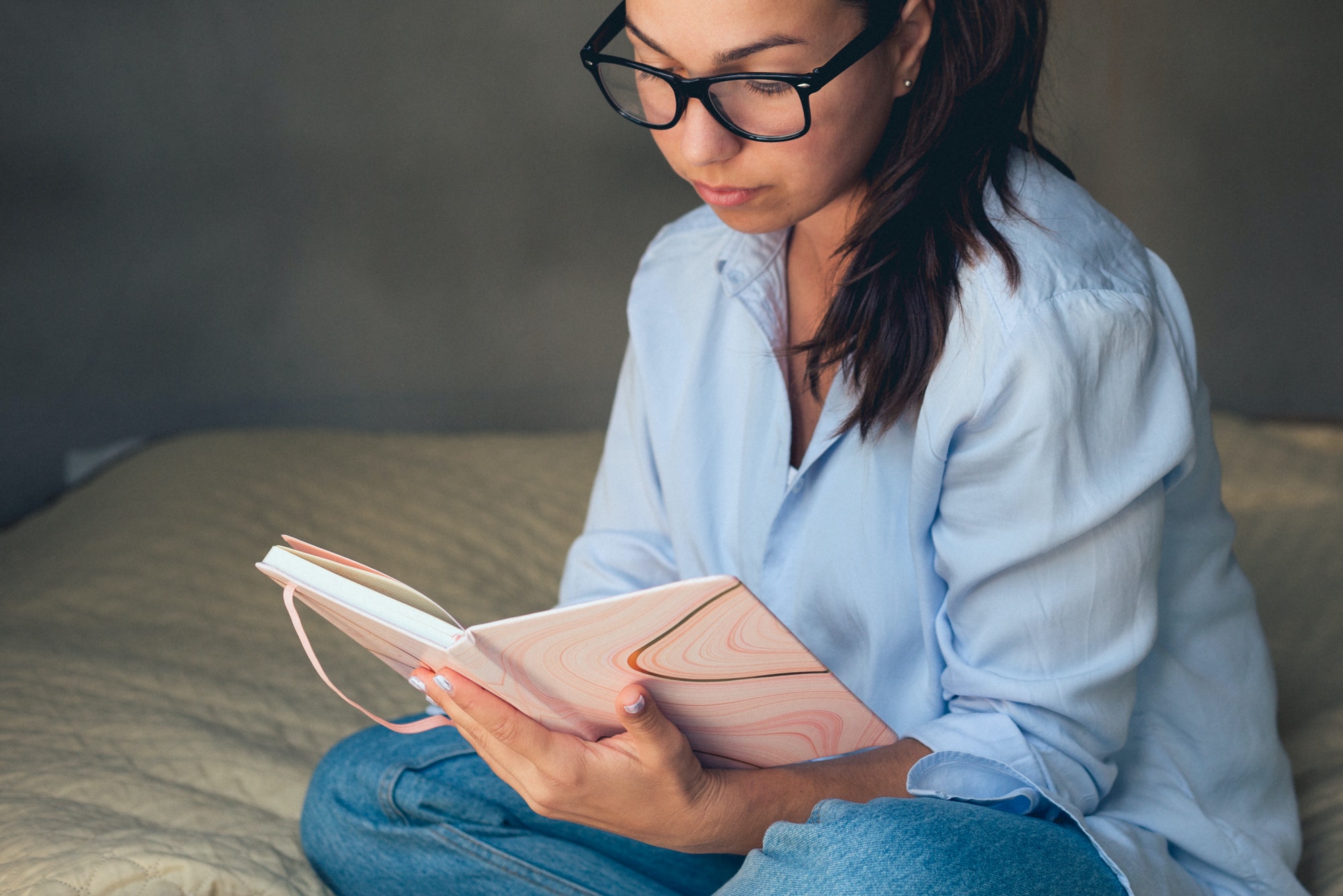 How to self publish a poetry book: Photo of a woman reading a book