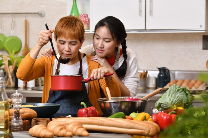 Mother and daughter cooking in the kitchen