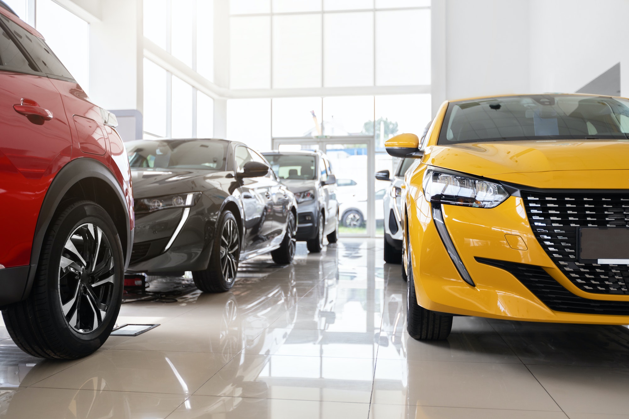Luxury cars in a car dealership are an example of direct competition.